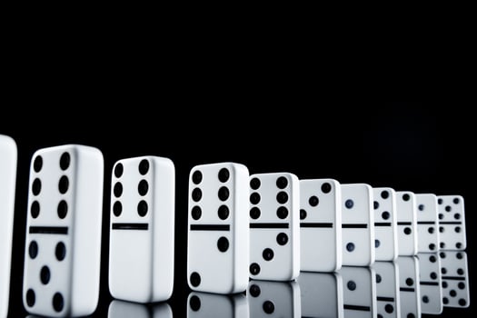 White dominoes in the dark close up photo