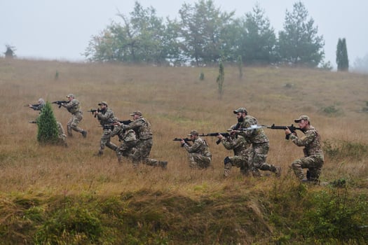 A disciplined and specialized military unit, donned in camouflage, strategically patrolling and maintaining control in a high-stakes environment, showcasing their precision, unity, and readiness for photo