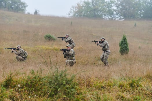 A disciplined and specialized military unit, donned in camouflage, strategically patrolling and maintaining control in a high-stakes environment, showcasing their precision, unity, and readiness for photo