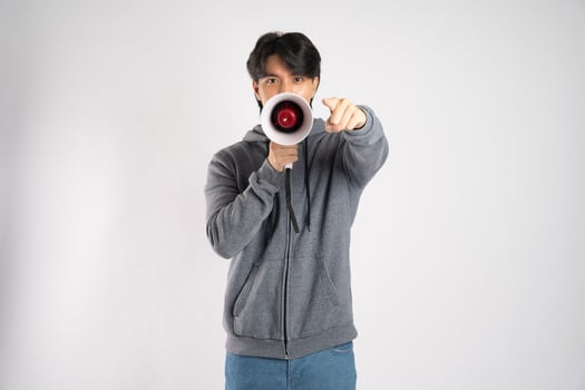 Portrait of asian man wearing hoodie posing on white background photo