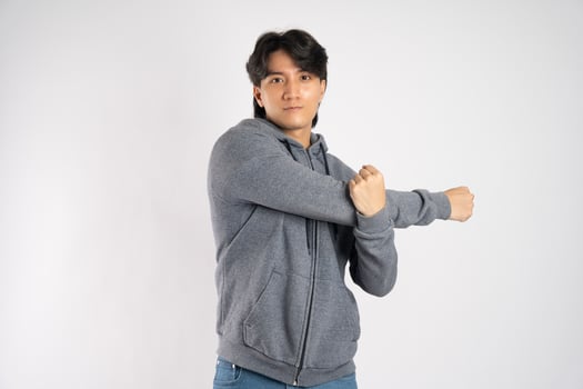 Portrait of asian man wearing hoodie posing on white background photo