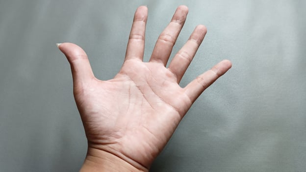 Man's hand, Man's palm on gray background photo