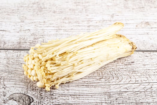 Tasty raw enoki mushroom heap photo