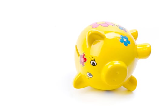 yellow piggy bank isolated on white photo