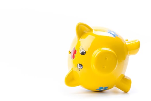 yellow piggy bank isolated on white photo