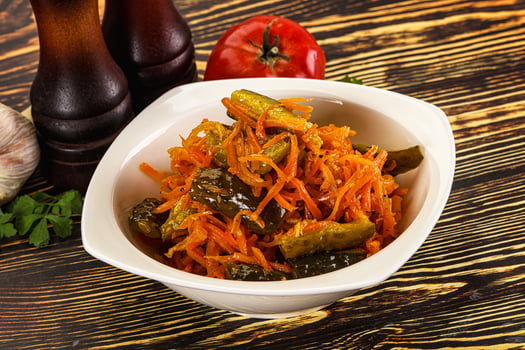 Salad with korean carrot and cucumber photo