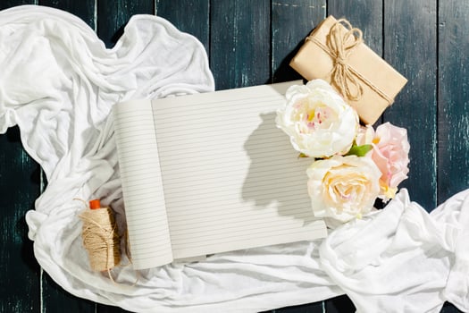 flowers with empty vintage notebook for your design photo