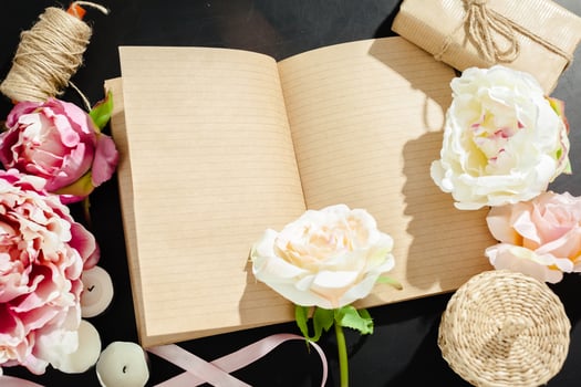 flowers with empty vintage notebook for your design photo