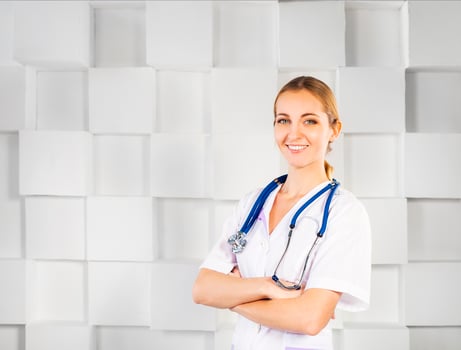 Smiling woman doctor in uniform looking at camera photo
