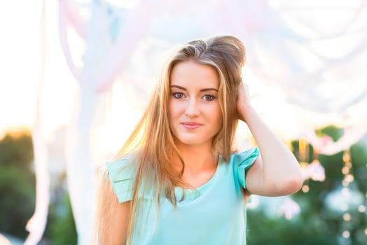 Outdoor portrait of beautiful young blond woman photo