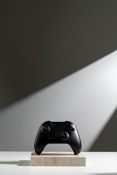 Joystick on sunlight against gray background close up photo