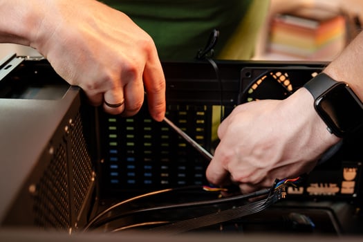Close up of man repairing computer system unit photo