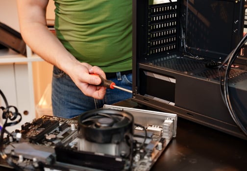 Close up of man repairing computer system unit photo
