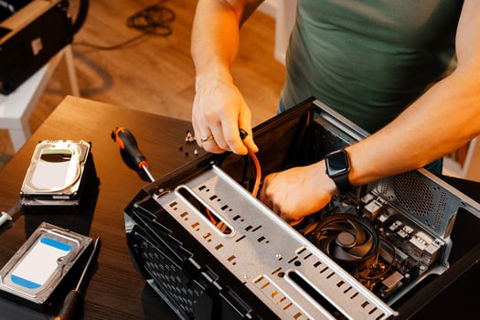 Close up of man repairing computer system unit photo