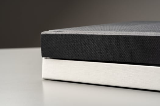 Blank notepad on gray background studio shot photo