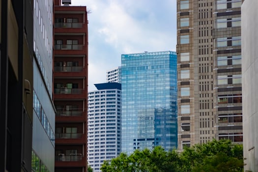 A cityscape of cloud reflecting on the building in Shinjuku Tokyo telephoto shot photo