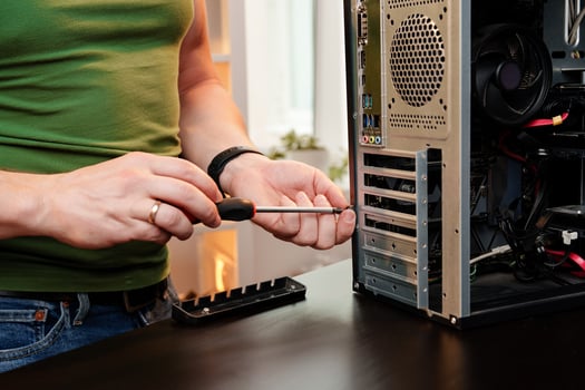 Close up of man repairing computer system unit photo