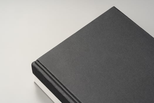 Blank notepad on gray background studio shot photo