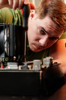 Man assembles a computer system unit at home photo