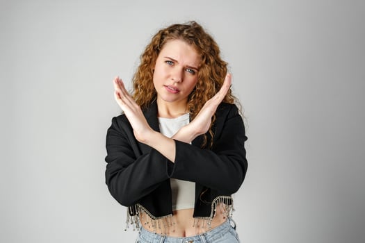 Young Woman Standing With Her Arms Crossed photo
