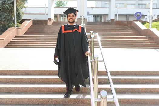 education, graduation and people concept - happy Indian Male graduate student photo