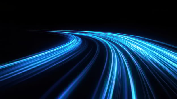 Light trails on a black road photo