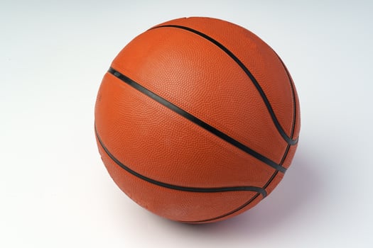 New orange basketball ball isolated on white photo