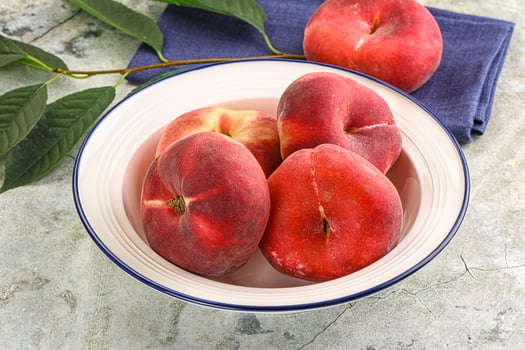 Ripe sweet and juicy Flat peach photo