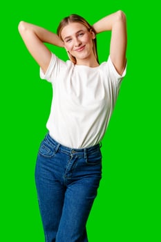 Young Woman in White Shirt Posing for Picture against green background photo