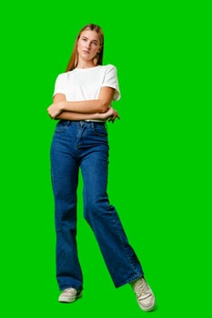 Young Woman in White Shirt Posing for Picture against green background photo