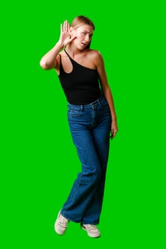 Young Woman in Black Top Holding Hand to Ear photo