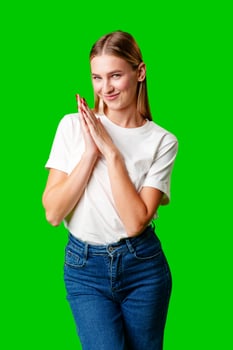 Young Woman in White Shirt Posing for Picture against green background photo