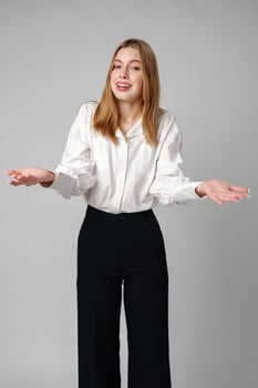 Woman in Formal Suit Holding Out Her Hands photo