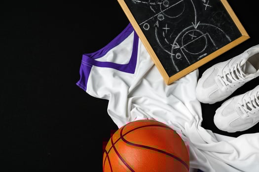 Basketball Outfit and Accessories Laid Out on Dark Background photo