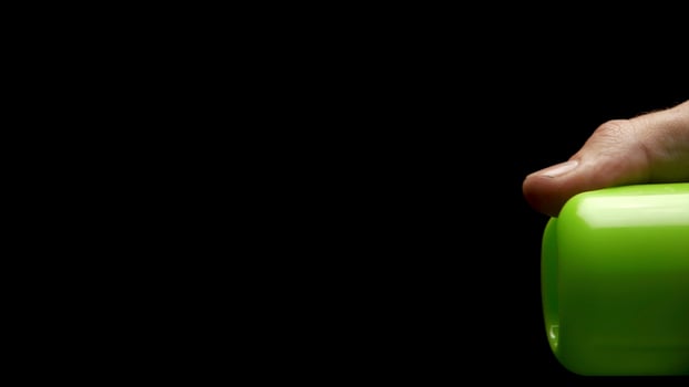 Sprayed air freshener in hand isolated on black. Automatic Air Freshener Isolated on Black Background. air freshener spray in front of black background photo