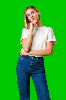 Young Woman in White Shirt Posing for Picture against green background photo