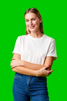 Portrait of an upset young casual girl against green background photo