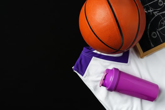 Basketball Strategy Planning With Chalkboard, Ball, and Jersey on Dark Background photo