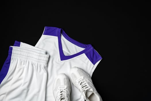Basketball Outfit and Accessories Laid Out on Dark Background photo