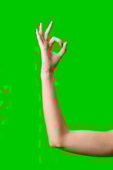 Womans Arm Hand Sign Raised in the Air photo