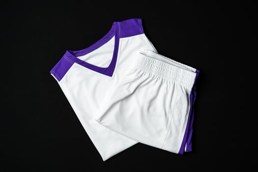 White and Purple Athletic Tank Top Laid Flat on Black Background photo