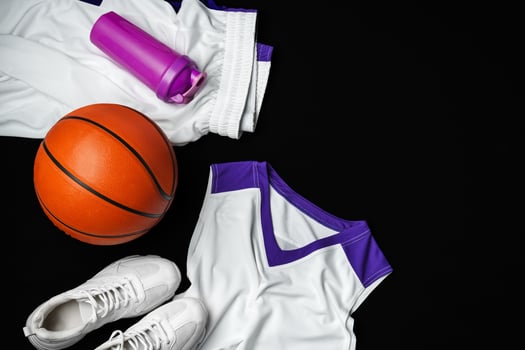 Basketball Gear Prepared for an Evening Training Session on a Dark Backdrop photo