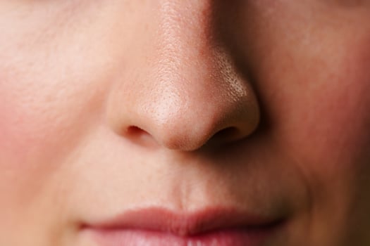 Close-Up of a Womans Lips and Nose With a Neutral Expression photo