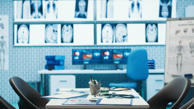Empty cabinet in a private facility equipped with x ray machine and modern tools used in medicine, clinic working on disease prevention and therapy, helping with treatment on insurance. photo