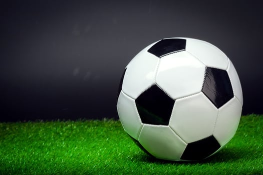 soccer ball on the green field photo