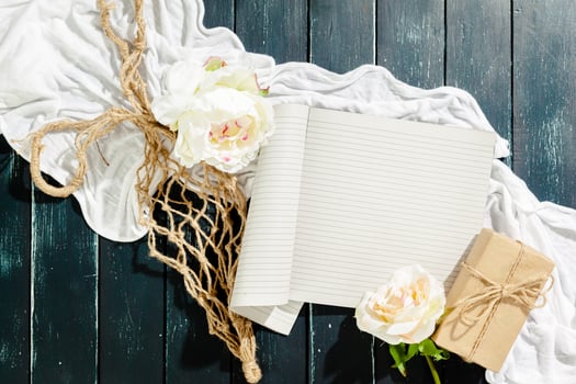 flowers with empty vintage notebook for your design photo