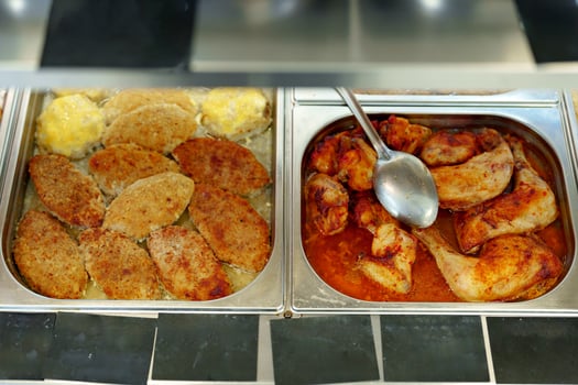 Variety of Food Displayed on Buffet Table photo