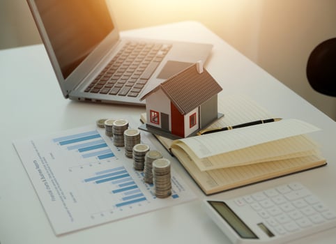 Saving money wealth concept, asian young business woman hand write management budget for saving cost, cash finance planning to spend enough money on her income for save money, payment tax, investing. photo