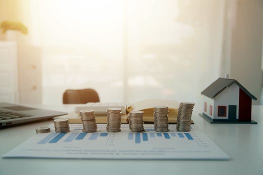Saving money wealth concept, asian young business woman hand write management budget for saving cost, cash finance planning to spend enough money on her income for save money, payment tax, investing. photo