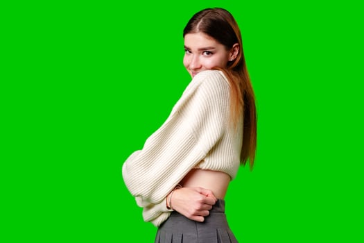 Woman in White Sweater Posing for Camera photo